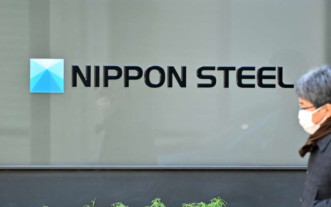 The logo of Nippon Steel Corp. is seen at an office building where the company's head office in Tokyo on December 19, 2023. Shares in Japan's Nippon Steel sank more than six percent on December 19 after it announced a deal to buy US Steel for more than $14 billion that will create the world's number two steelmaker. (Photo by Kazuhiro NOGI / AFP)